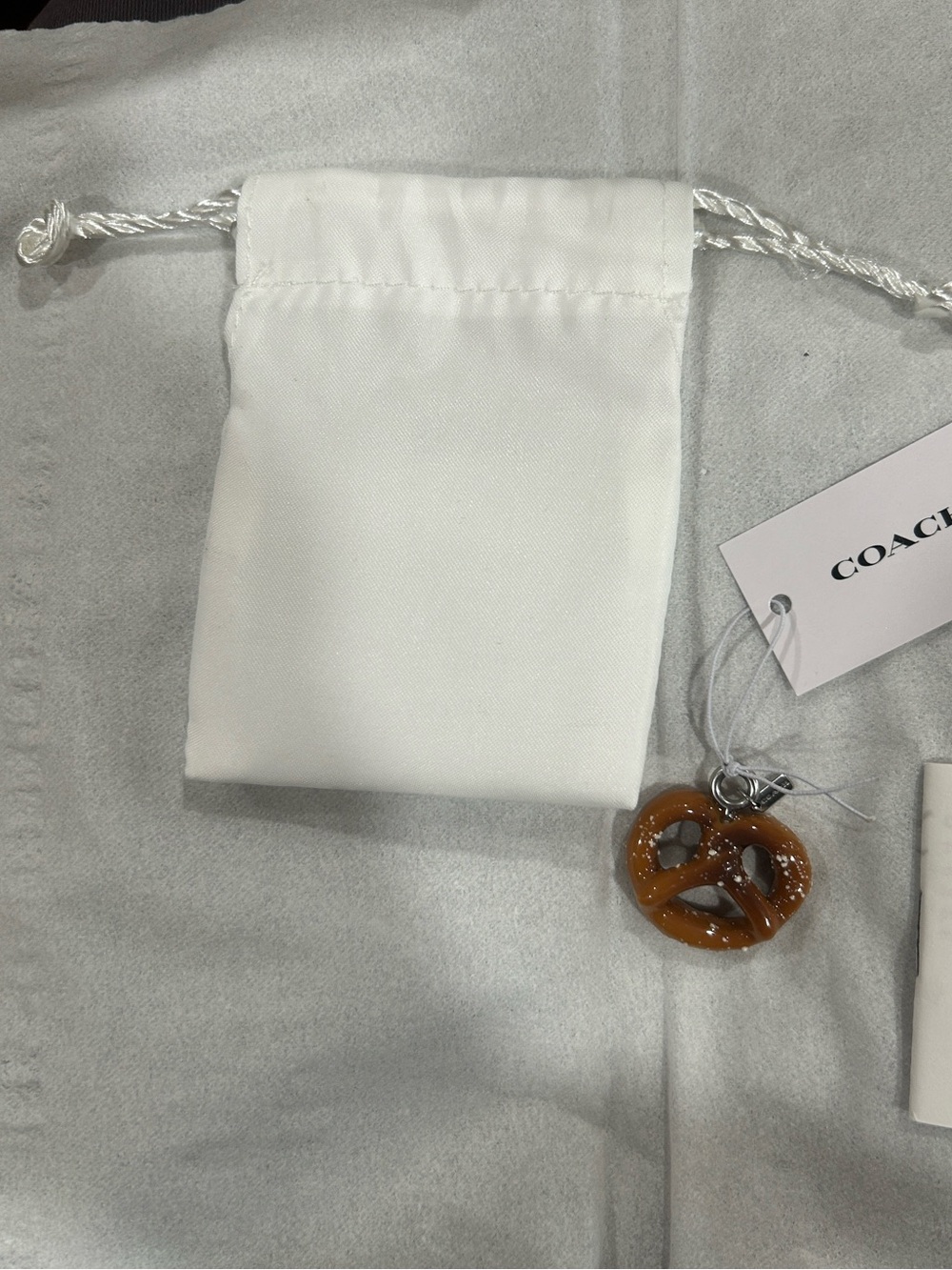 Coach Pretzel Charm with micro hang tag, care booklet, tag & Dust Bag. NWT - Picture 6 of 7